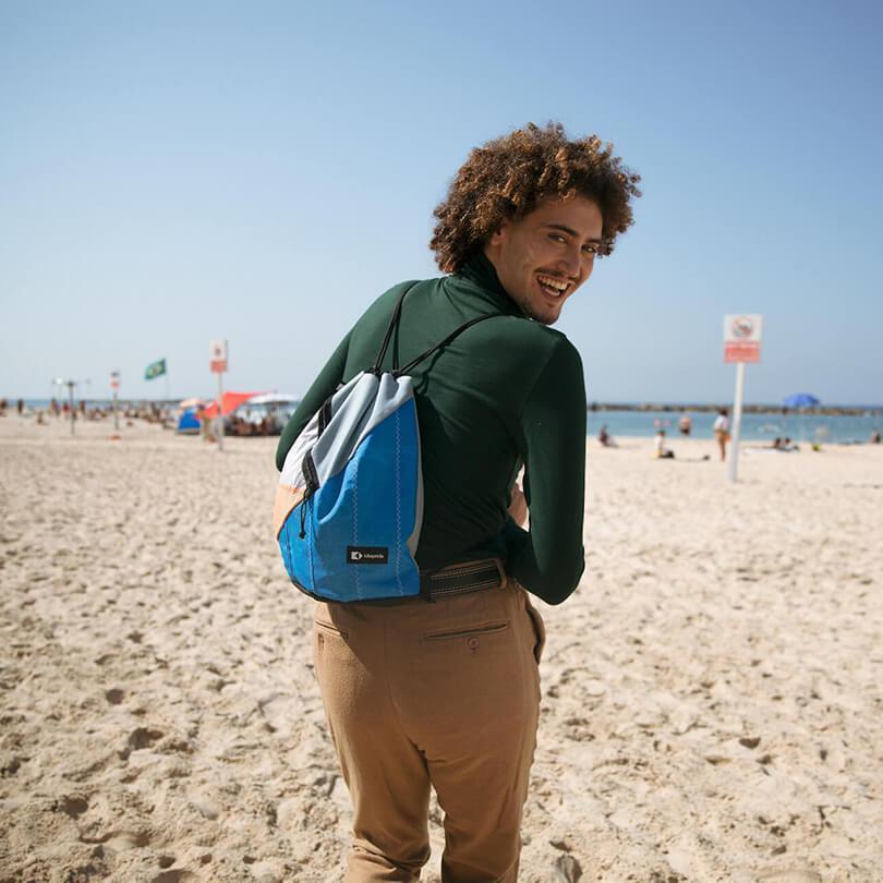 An upcycled KitePride stylish, handmade in Tel Aviv Drawstring designed to fill your everyday needs with a social and environmental impact.